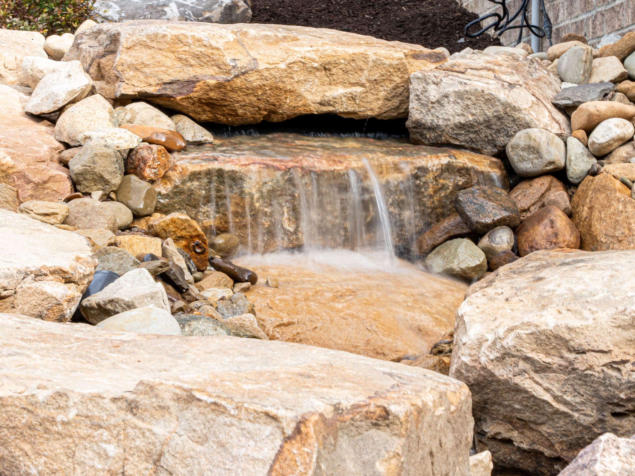 boulder waterfall closeup - Elements Landscape Management