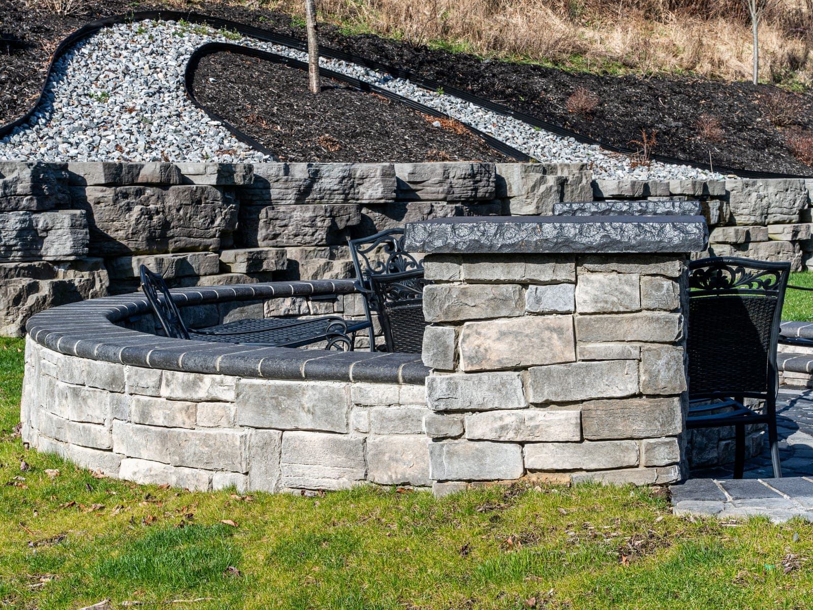 fire pit seating retaining wall backdrop - Elements Landscape Management