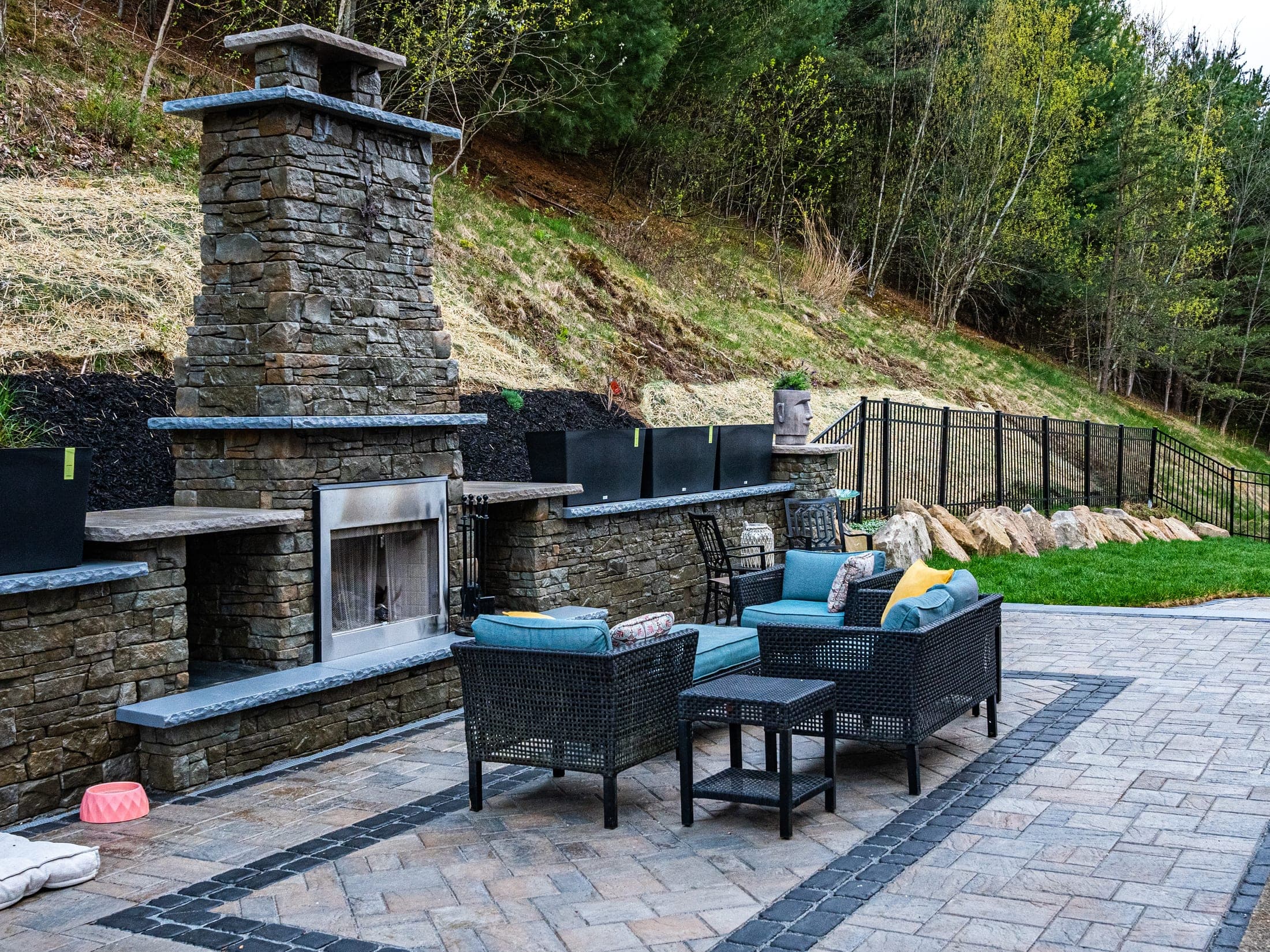 fireplace seating dusk glow - Elements Landscape Management