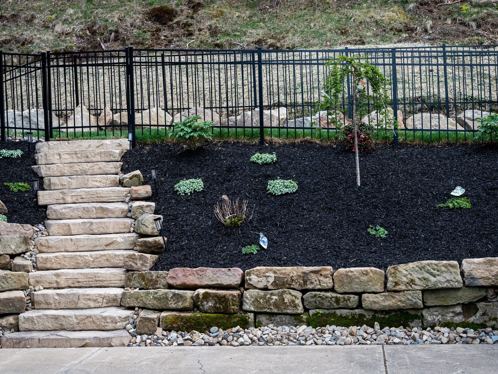 stone fireplace covered patio - Elements Landscape Management