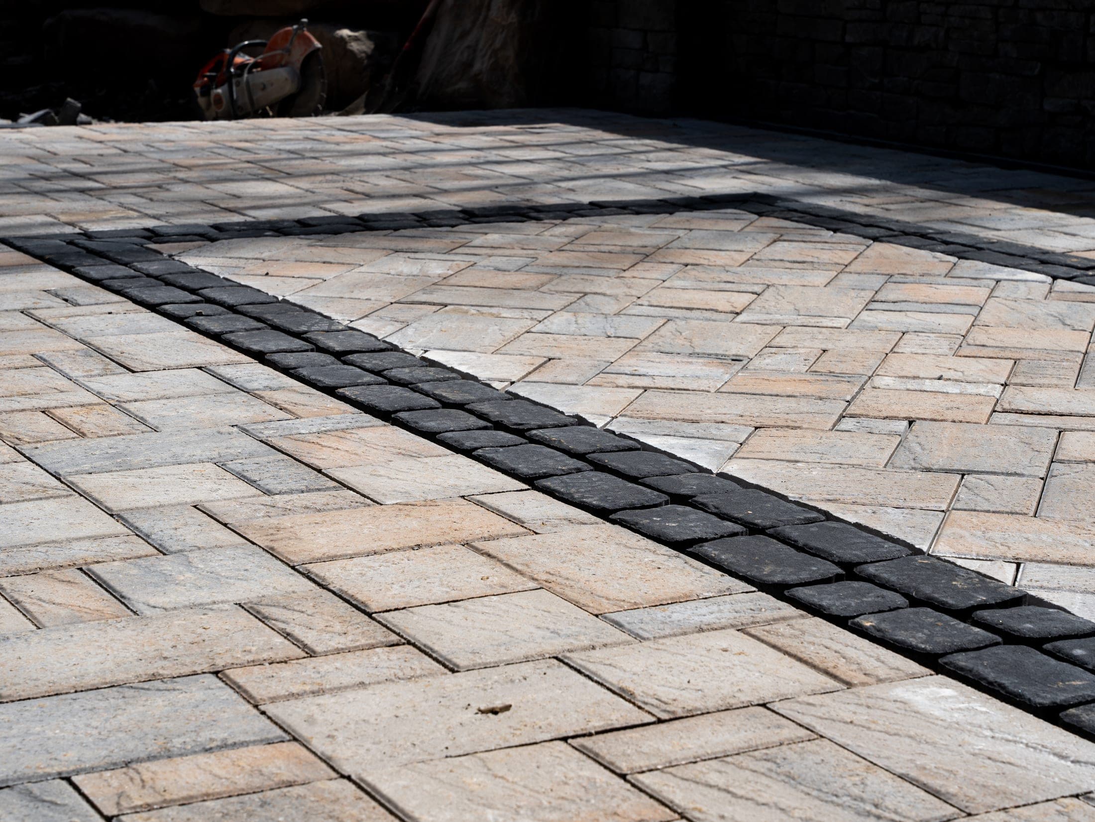 Porcelain paver patio with a soldier course border detail