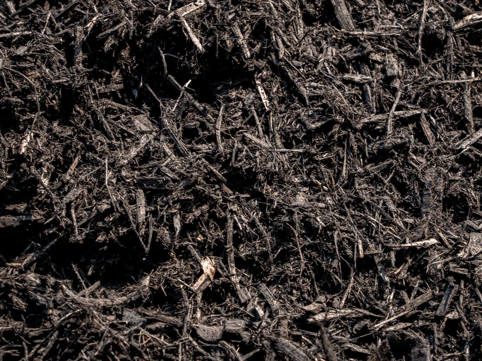 dark premium undyed mulch - Elements Landscape Management