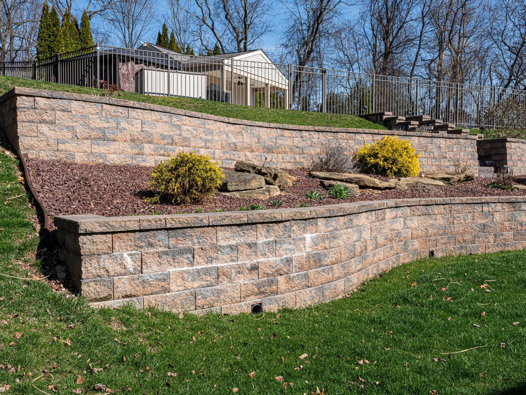 tiered wall flowering shrubs - Elements Landscape Management
