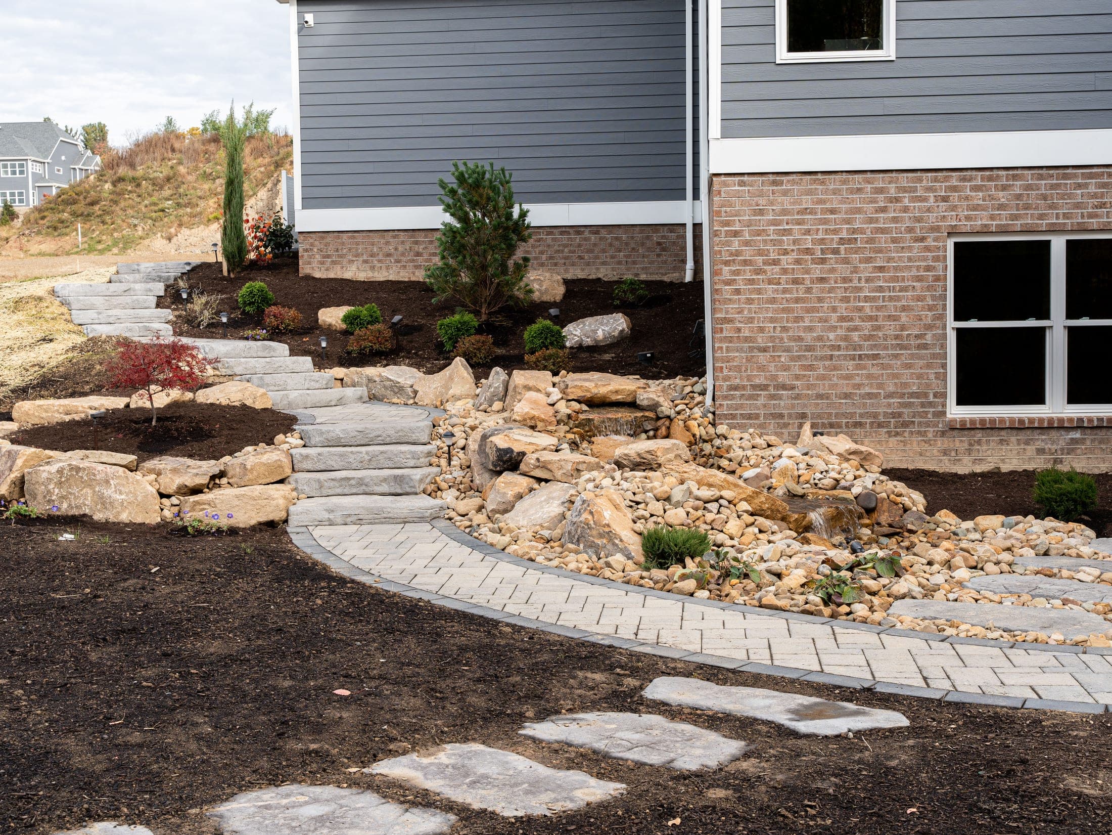 Boulder water feature with stone steps
