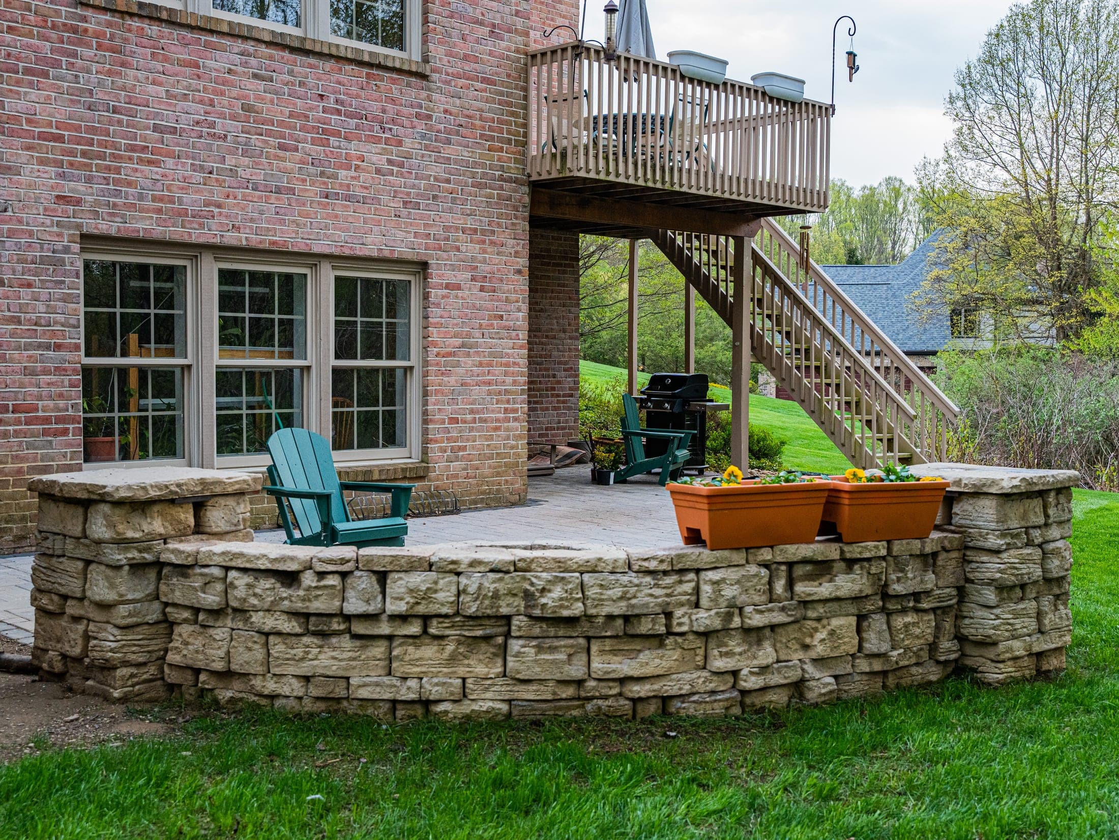 Fire pit patio with string lights at dusk