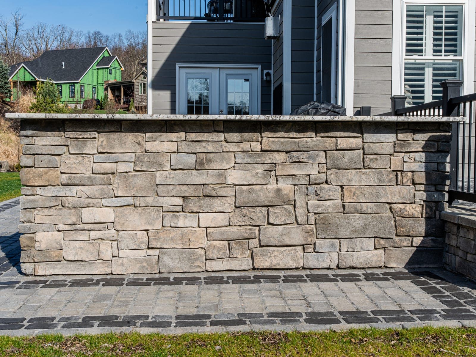 Stone bar wall with a granite cap