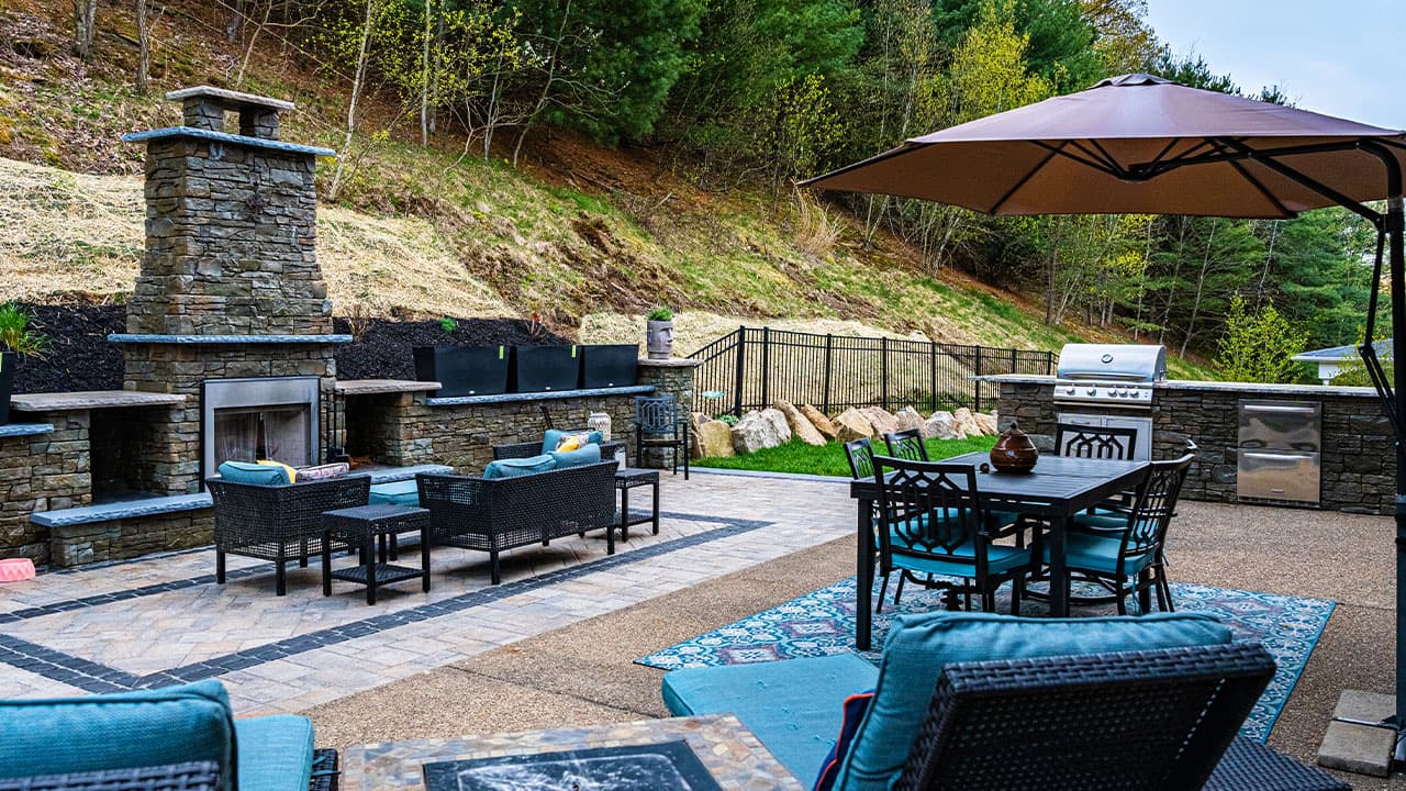 Patio with outdoor kitchen and fireplace