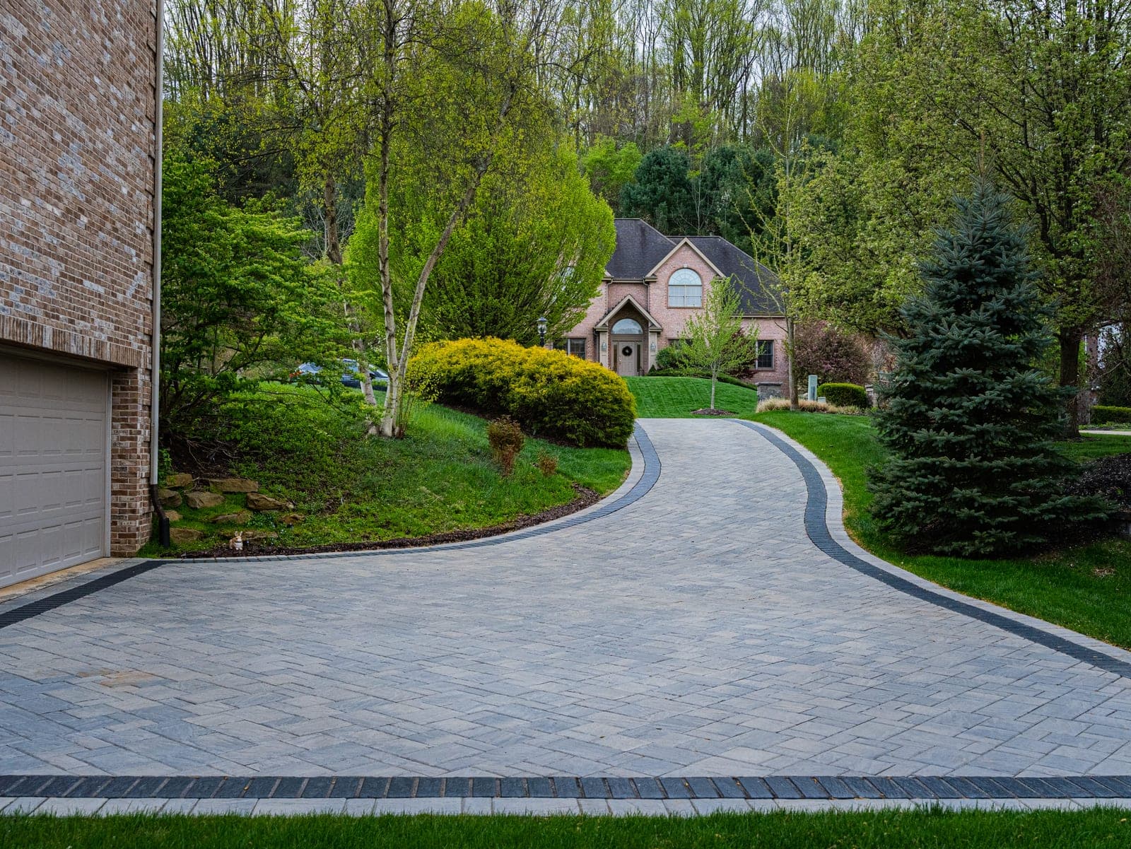 Paver driveway with front planting beds