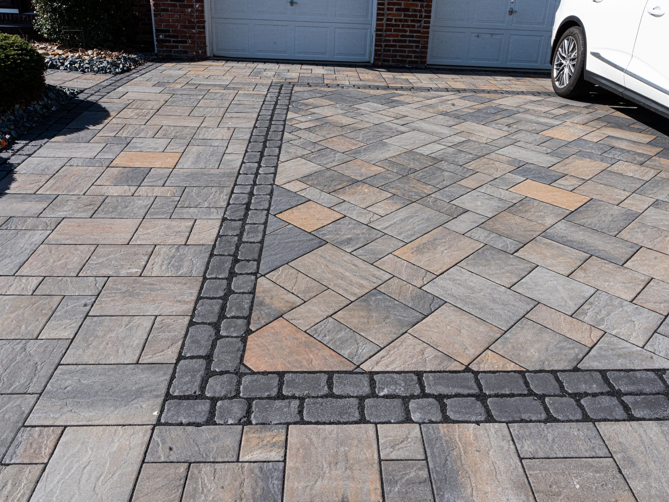 Paver driveway with a medallion pattern centerpiece