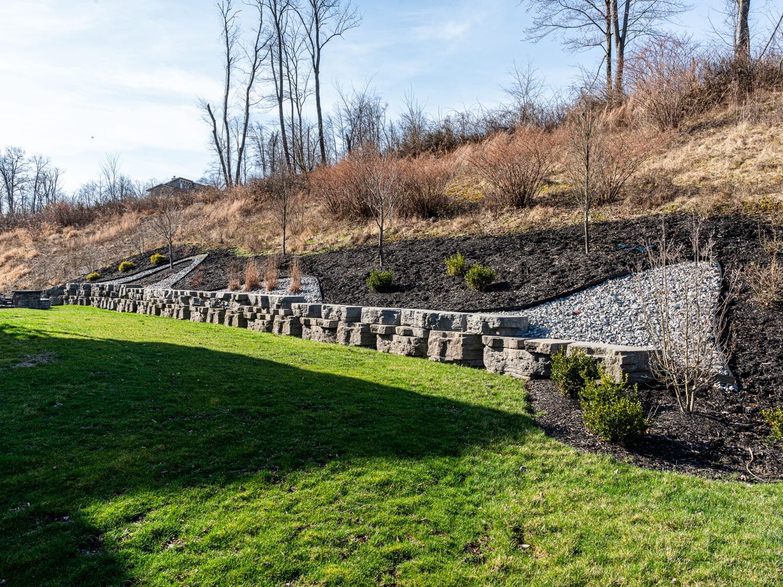 Curved retaining wall built into a hillside