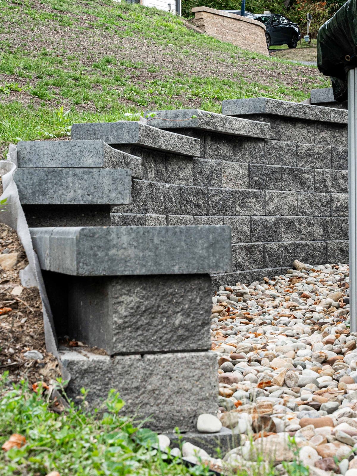 Terraced stone steps built into a tiered retaining wall
