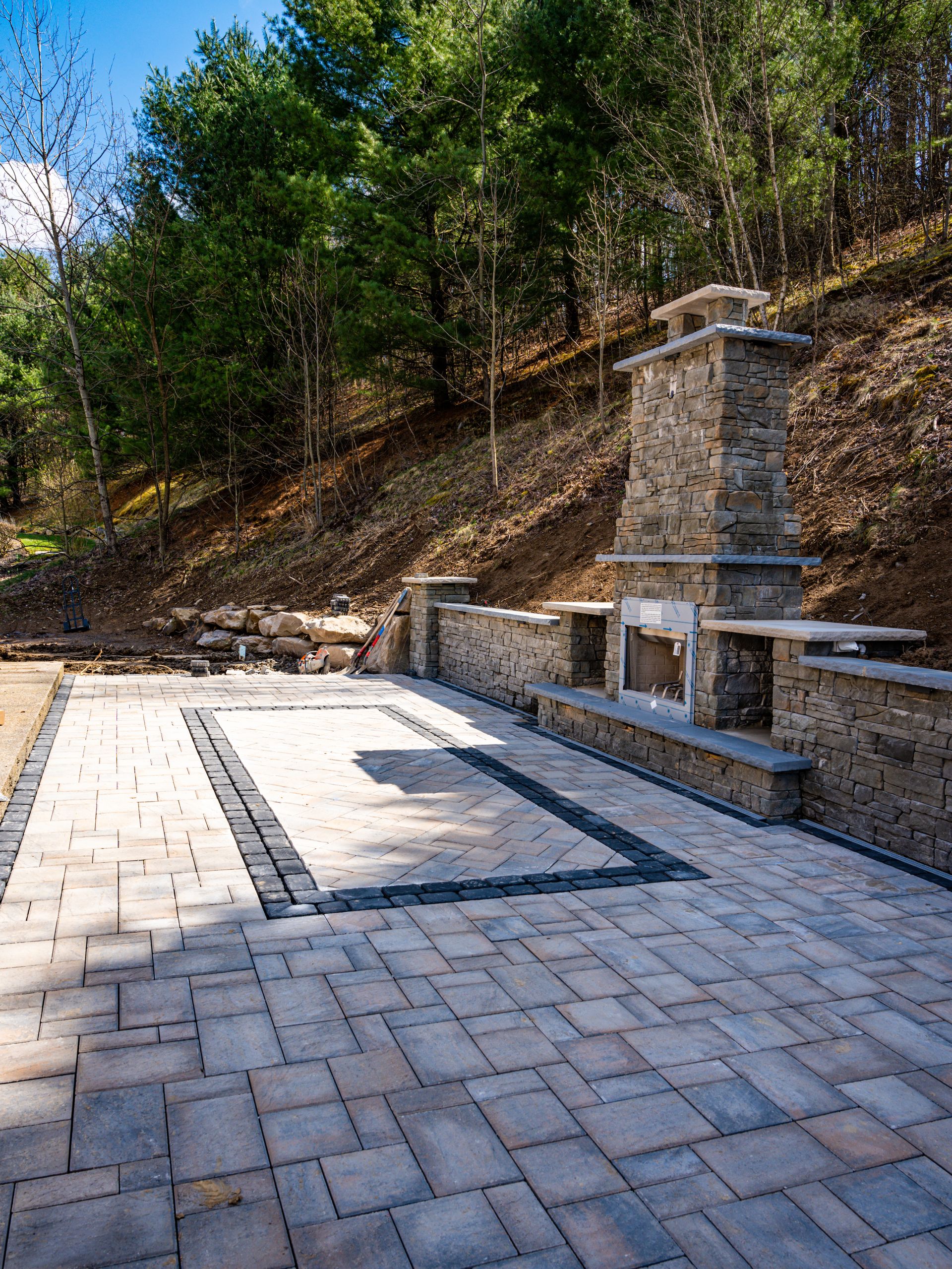 Custom outdoor fireplace with paver patio in Baden PA