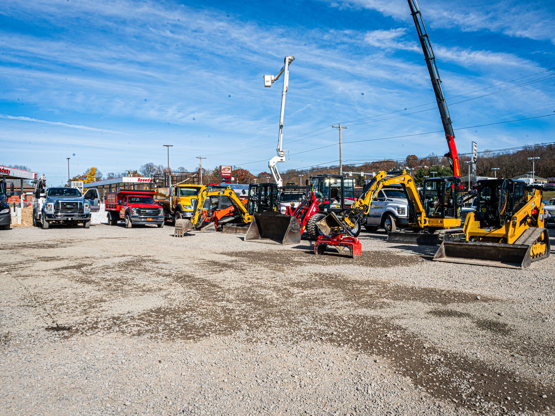 Elements Landscape full equipment fleet lineup including excavators, skid steers, and trucks